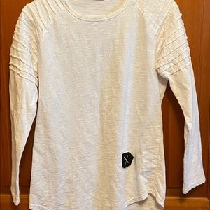 White unbranded shirt.  Washed, tried on, and washed again.  Calling this size M